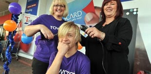 Young Owen loses his locks for charity