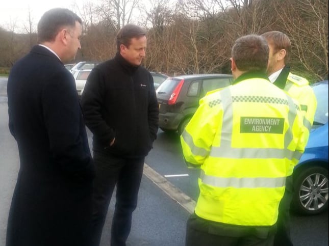 FLASHBACK: MP Mel Stride and David Cameron at the scenes of flooding in Buckfastleigh in 2012.