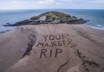 Bigbury pays tribute to Her Majesty with message in the sand 