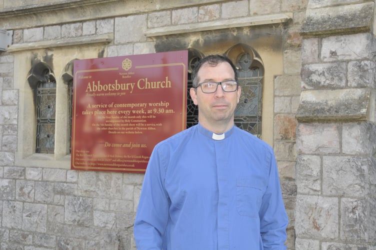 Reverend Gareth Regan welcomed people to Abbotsbury Church to watch Queen Elizabeth II’s funeral among company.