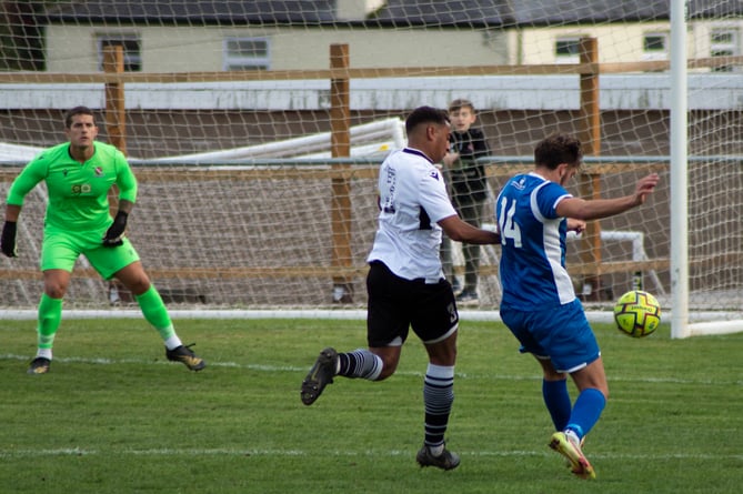 Leon Tootell (right) battles with Teignmouth captain Myles James.