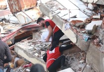 As Rotarians raise £2K for quake victims they urge people to donate
