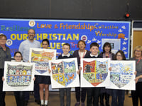 Pupils show off mosaics to art society donors