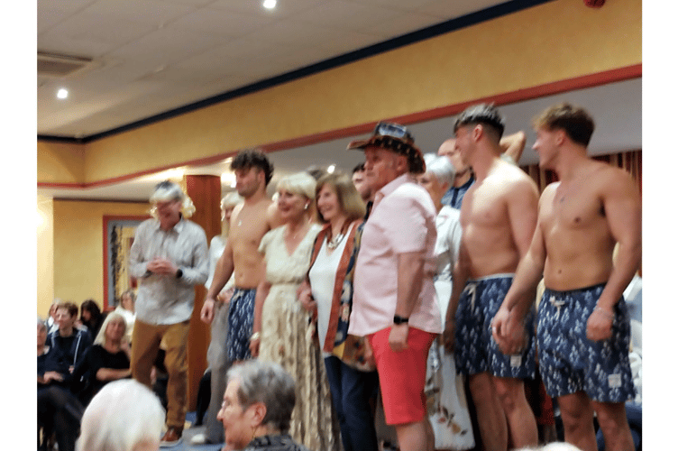 A bit of ‘eye candy’ for the ladies of the Teignmouth Tangent and the latest fashions help raise £2,608 for the Devon Air ambulance