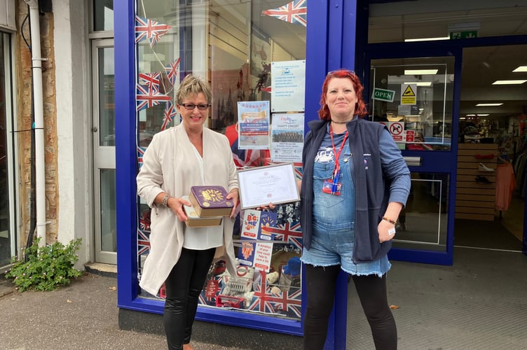 Sally Henley present Devon Air Ambulance's Newton Abbot charity shop manger Cheryl with her prize