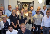 Charity darts team is thrilled to raise £1,000