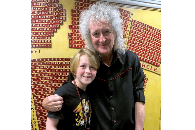 11-year-old Harry Churchill with Sir Brian May of Queen fame