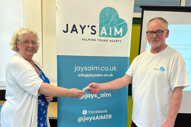 Karen Jenks, of Newton Abbot WI, welcomes Jim Conway from Jay's Aim.Picture: Karen Jenks (7-7-23)