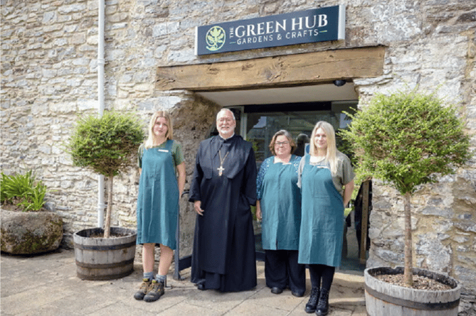 The Green Hub team at Buckfast Abbey, pictured with Abbot David Charlesworth OSB.