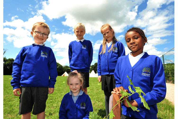 At Teignmouth Primary School 50th anniversary tree planting. Showing off their new Teignmouth Primary School jumpers are pupils Rory, Lottie-Mai, Freddie, Erin and Audrey.