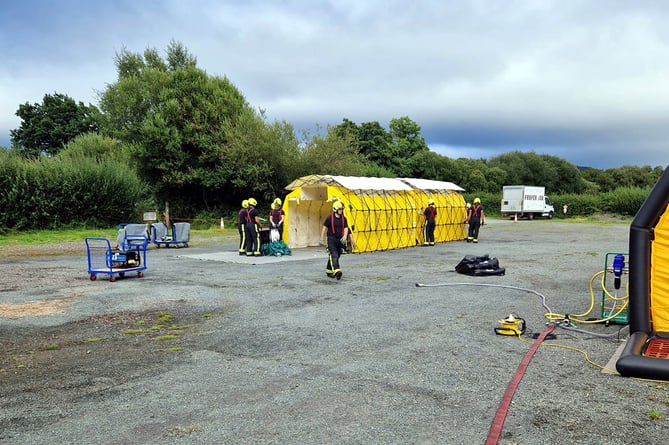 Firefighters carry out DECON training