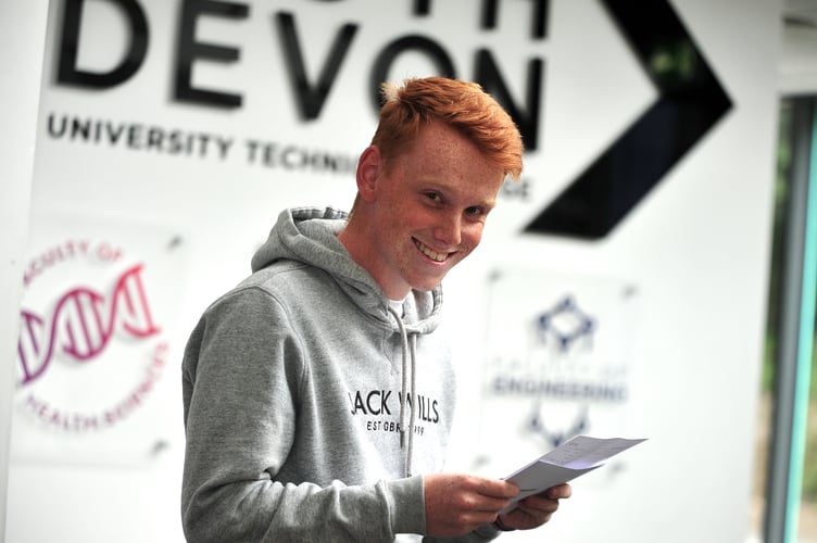 A-Level results at South Devon University Technical College. James Roberts obviously happy with his triple distinction in Triple Engineering BTEC.
The Kingsteignton student will be returning to the college at the start of the autumn term. 'I'll be back here at SDUTC in September,' he explained. 'But this time I'll be wearing a staff lanyard and i.d. badge as I'll be working here as teaching assistant specialising in engineeering.'