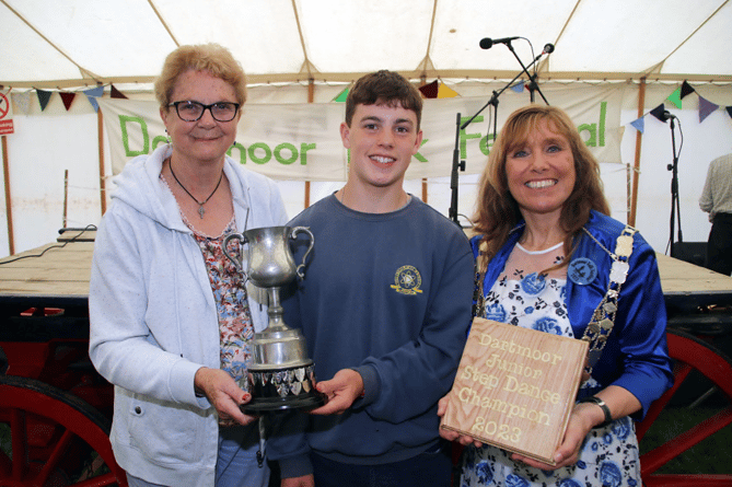 Stanley Frangleton receiving the Junior Step Dance Award from Shirley Bazeley, president, left, and the Mayor of West Devon, Cllr Lyn Daniels.
