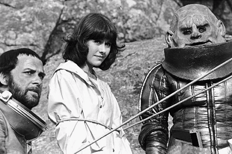 An episode of Dr Who being filmed at Hound Tor. A bound Sarah Jane and a menacing Sontaran.
