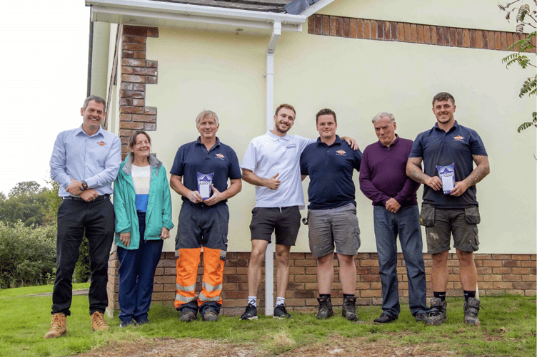 The Parsons with some of the kind-hearted workers.