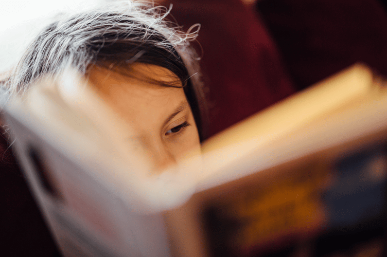 Child reading stock image
