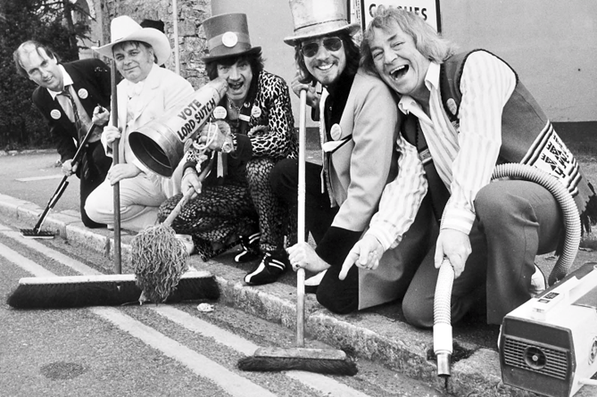 Not able to obtain a clean sweep in the polls, members of the Official Monster Raving Looney Party attempt a clean sweep of Ashburton. Screaming Lord Sutch (centre) is obviously in command of the clean-up party