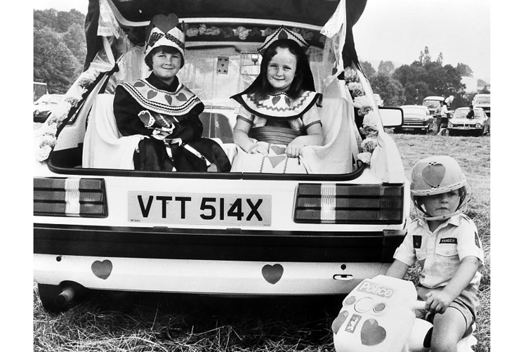 King and Queen of Hearts Victoria Bolton and Rachel Giles with motorccyle outrider Christopher Giles.