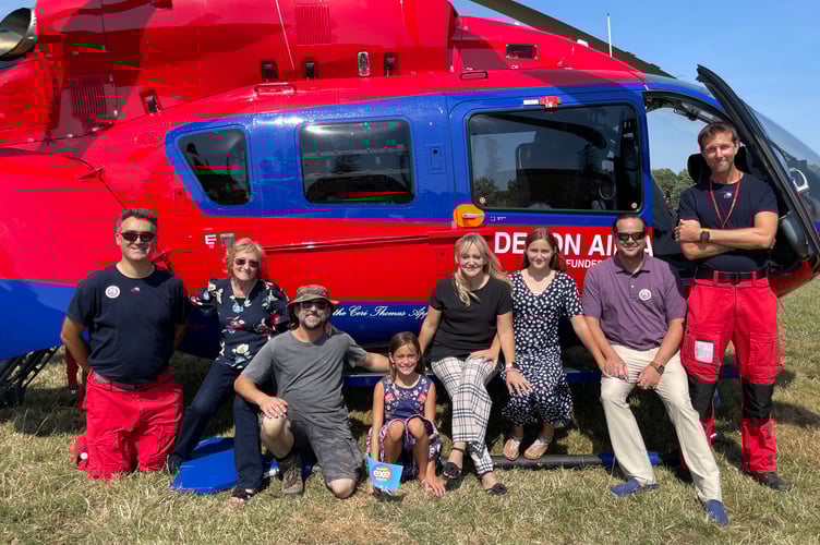 Ann Ralli, second left, with members of her family and some of the DAA paramedics last year. AQ 3244