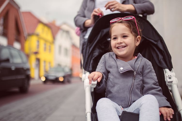 Devon County Council image of child in pushchair 