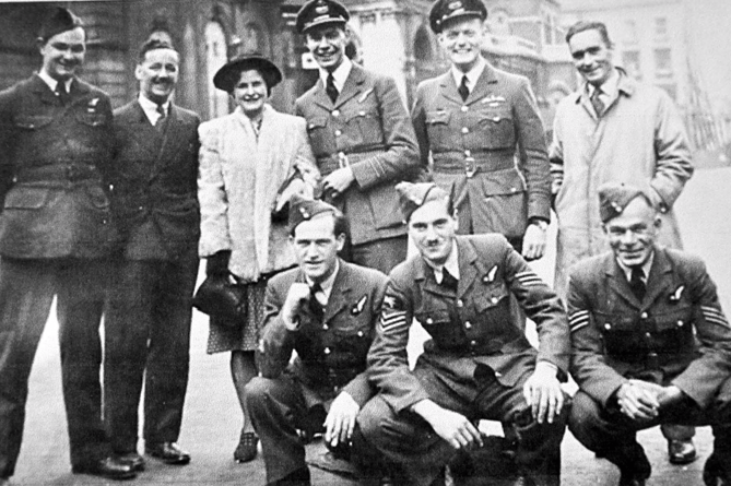 Harry (kneeling centre) and his Lancaster crew with skipper Ken Letford behind
him photographed outside Broadcasting House after the mission. Wynford Vaughan-
Thomas is pictured second left .