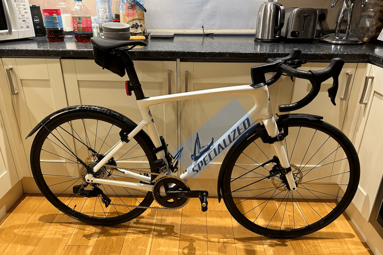 The second bike is a Specialized white Tarmac SL7 Comp with frame serial number 90622-5156