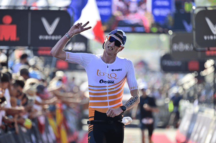 Donald crossing the finish line at the Ironman World Championships.