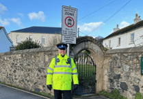 Police help keep busy road outside primary school safe for children