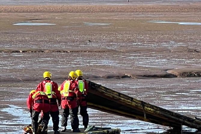 Firecrews come to the rescue of a person trapped in mud in the River Exe estuary