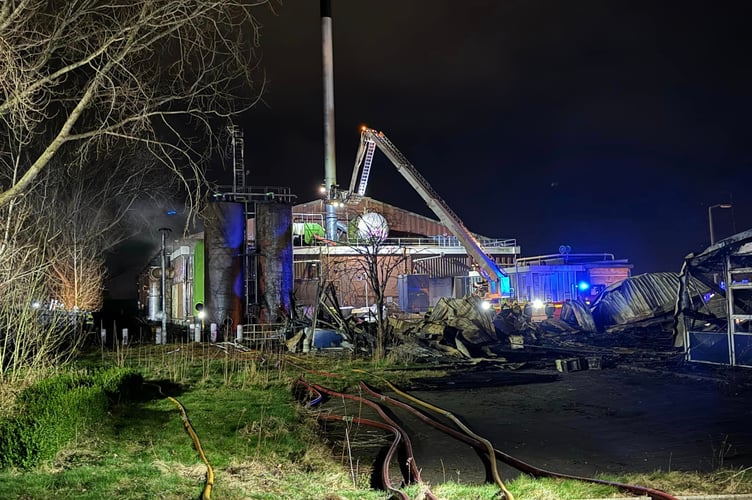 Fire crews at the scene of last night's fire at a derelict commercial property in Exeter  Photo:DanesCastleFireStation