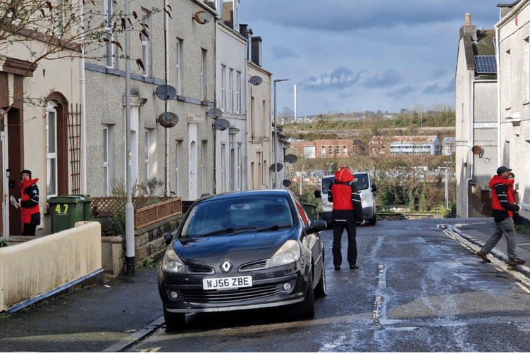 Dartmoor SAR volunteers doing door-to-door checks inside the cordon