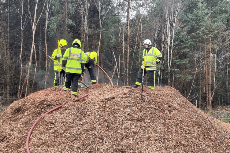 Pile of smoking wood chips sees Sunday action for Newton's firefighters