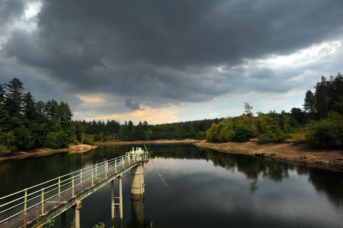 Photo: Steve Pope  MDA150822A_SP002
Summer drought 2022. Storm clouds gather over Tottiford Reservoir in the Teign Vally but it will need many months of rain to replenish the reservoir that is currently at  46% capacity