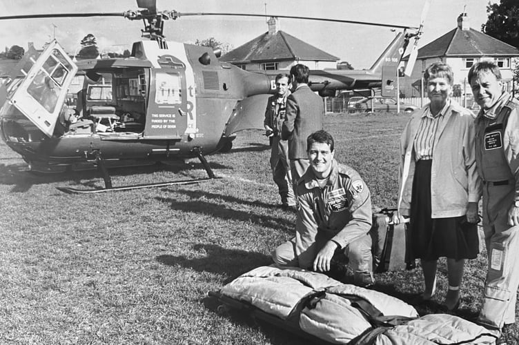 October 1995. Highweek Primary School in Newton Abbot receives a visit from the Devon Air Ambulance. The school's retired teacher Jenny Buckle is picture here with paramedics Dave Hartland and Chris Wyatt