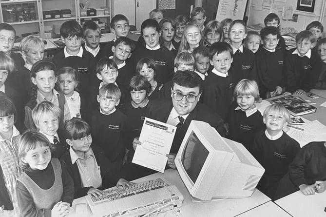 October 1995. New computer equipment for youngsters at Stokeinteignhead courtesy of Tescos. The store manager John Steer was on hand to present the pupils with their new Acorn computer