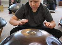 Children learn to bang the drum 