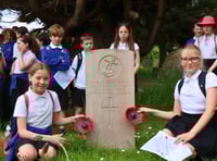 Children pay respects at war graves on D-Day anniversary 