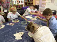 Children learn the art of silk painting 
