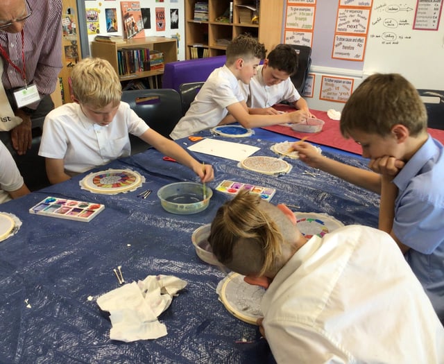 Children learn the art of silk painting 