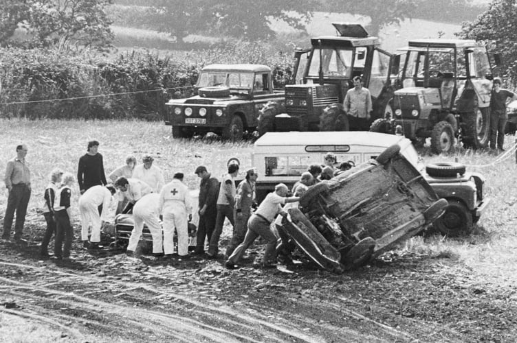 Banger Racing at Dawlish from August 1986. Rescue workers tend to the car of William Rainer who went off piste on one corner. Mr Rainer was reportedly taken to hospital with back injuries