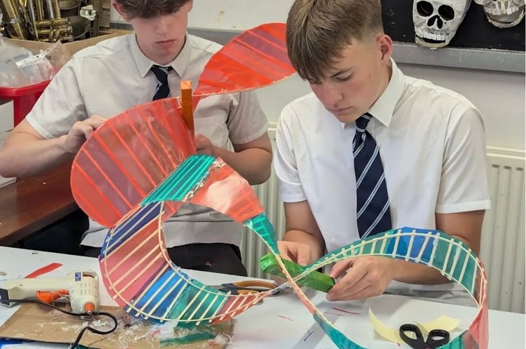 Coombeshead Academy students create Remembrance Day memorial. 