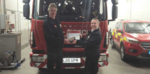 Firefighter's two decades of service recognised 
