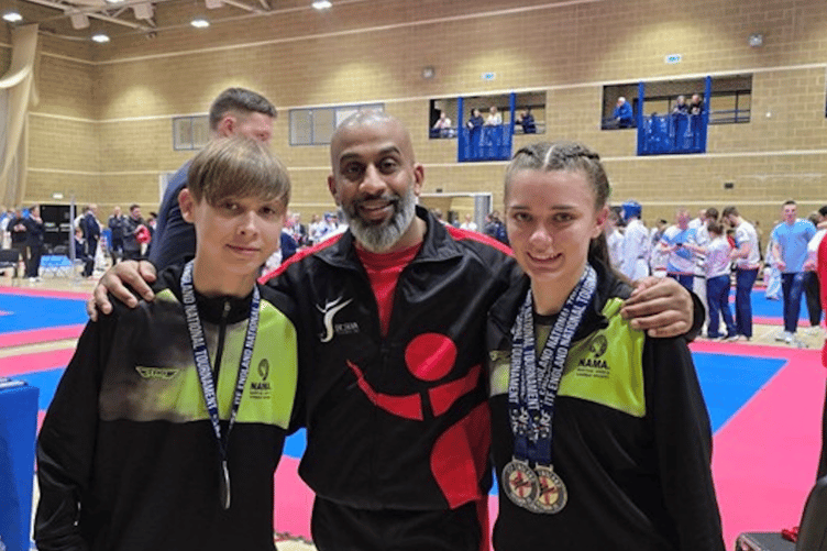 Christian Stocker and Crystal Mason either side of Master Johann de Silva