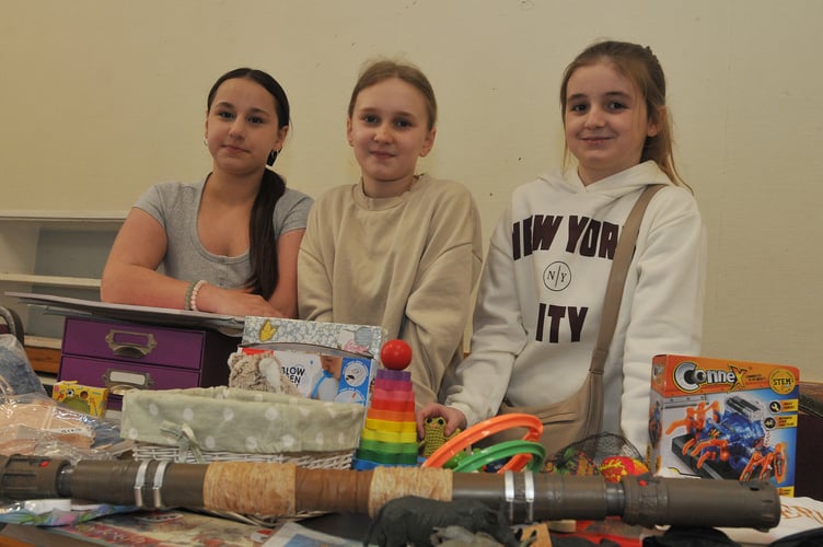 Newton Abbot Youth Council Art and Craft Fayre at the Courtenay Centre. Youth council members Nyla, Freya and Gracie readyfor business on one of the jumble sale stands