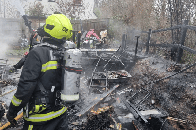 Garden ravaged by fire as crews save house 