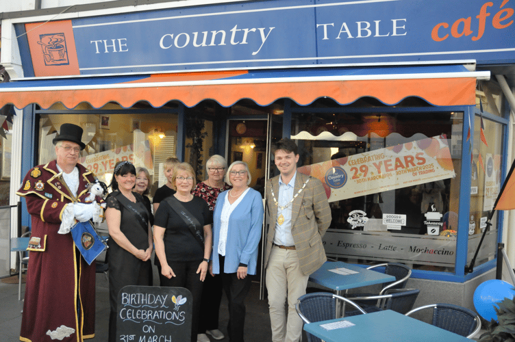 Mayor of Newton Abbot, Cllr Alex Hall, right, said a few words at Country Table's 29th anniversary today, March 31