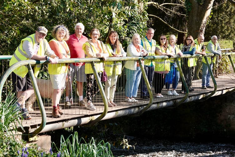 Volunteers WADE in to improve Dawlish Brook. PHOTO BOB SIMPSON