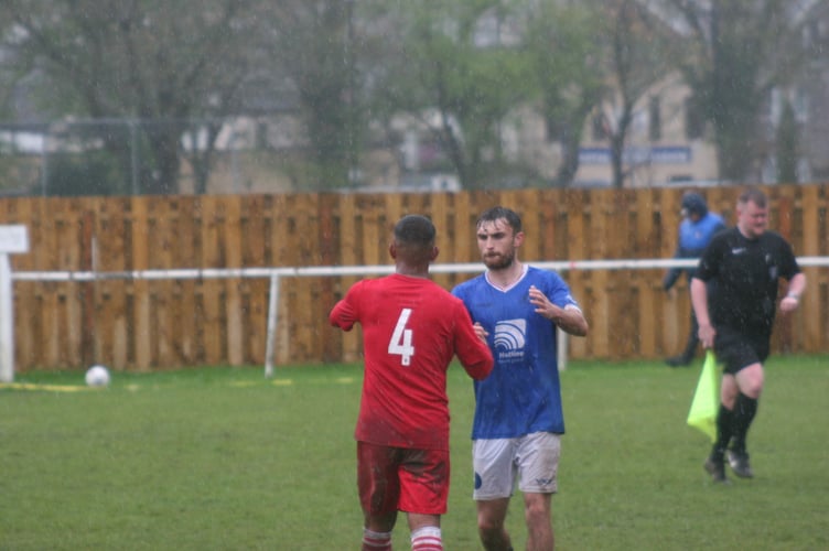 Handshakes at full-time between NA Spurs and Teignmouth AFC