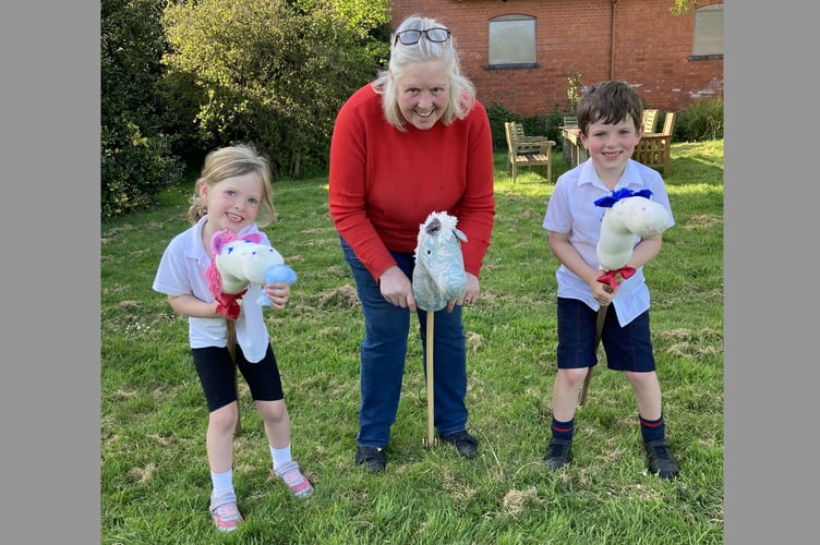 Deborah Custance Baker, centre, has issued an appeal for Hobby Horses for a parade of them at the Devon County Show.
