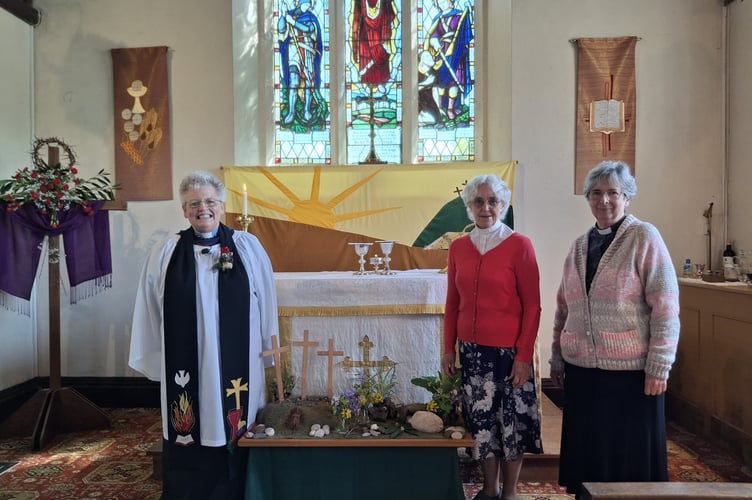 Celebrating the 80th anniversary of St George's Church Holcombe are, left to right, Rector of the Dawlish Coast Mission Community, Revd Linda Cronin. and former vicars of St George's Revd Helen Bays and Preb Chris Curd. Photo Lin Goodman-Bradbury